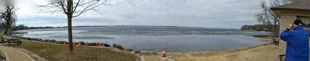 Wisconsin Assistant State Climatologist, Ed Hopkins, surveys the ice on Lake Mendota from Maple Bluff
