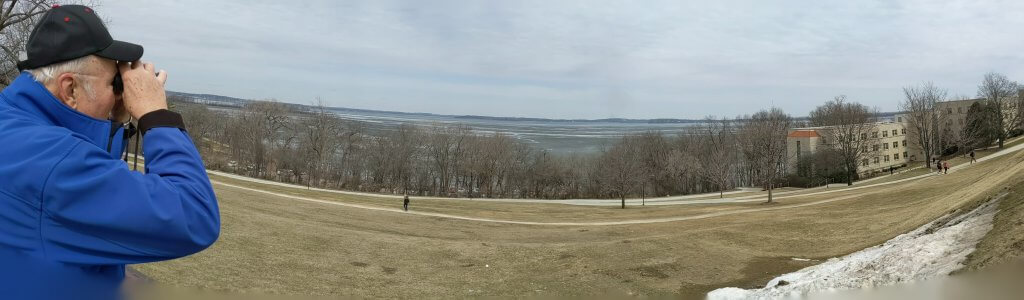 Wisconsin Assistant State Climatologist, Ed Hopkins, observes ice cover on Lake Mendota from Observatory Drive in Madison. March 29, 2019.